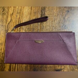 Henri Bendel burgundy saffiano leather wristlet clutch. Never used.